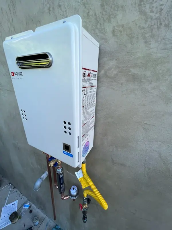 Tankless water heater installation for Wellington - Harrington homes